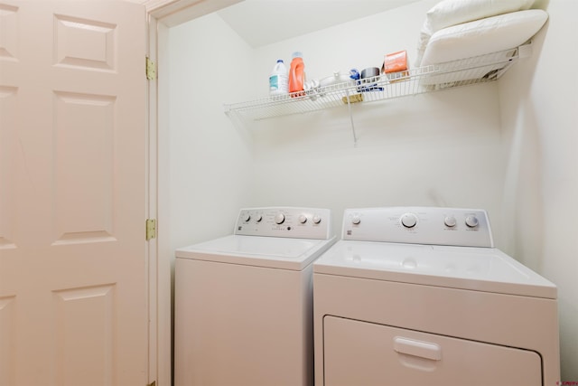 laundry room with washing machine and clothes dryer