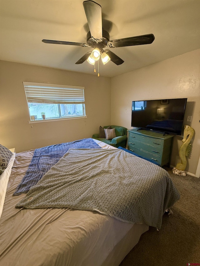 bedroom featuring baseboards, ceiling fan, and carpet flooring