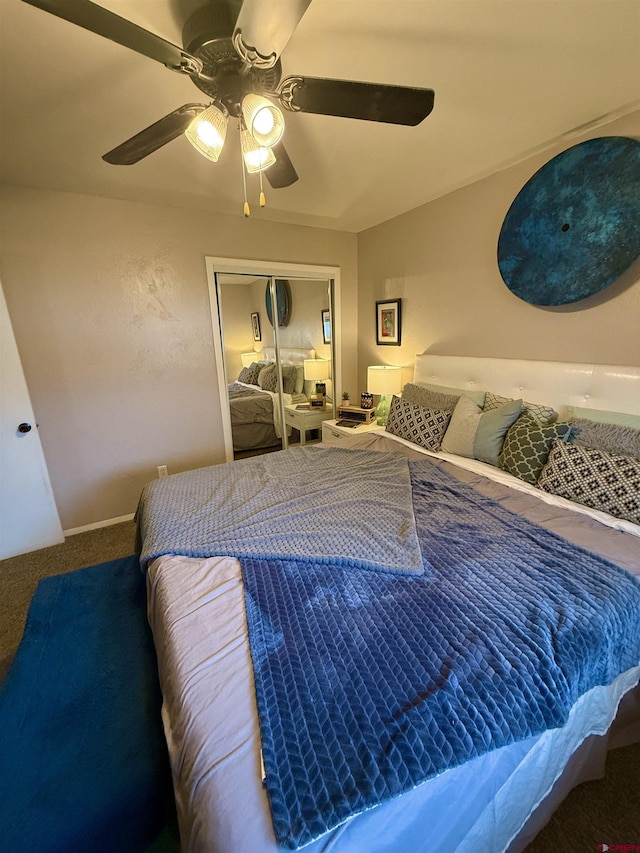 carpeted bedroom with a closet and ceiling fan