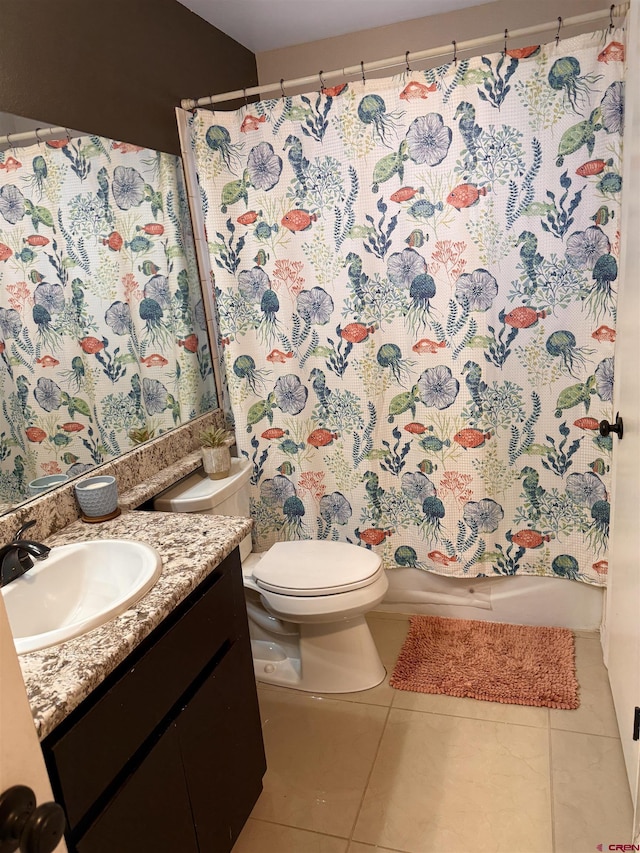 full bath with vanity, tile patterned floors, shower / tub combo, and toilet