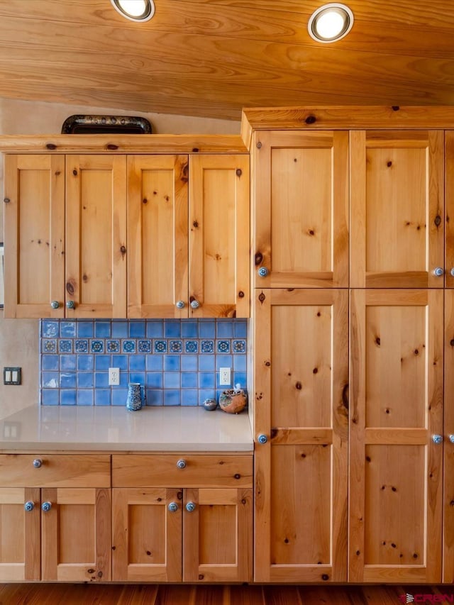 room details featuring recessed lighting, tasteful backsplash, and wooden ceiling