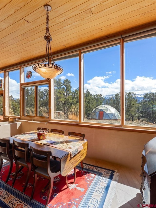 sunroom / solarium with wood ceiling