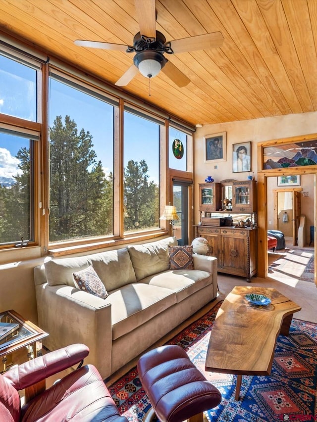 living area featuring wooden ceiling and ceiling fan