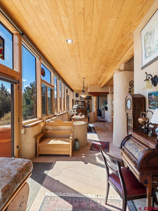 sunroom featuring wooden ceiling