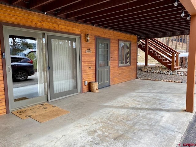 view of patio / terrace featuring stairs