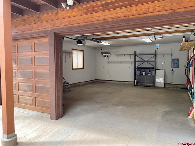 garage featuring electric panel, baseboards, and a garage door opener