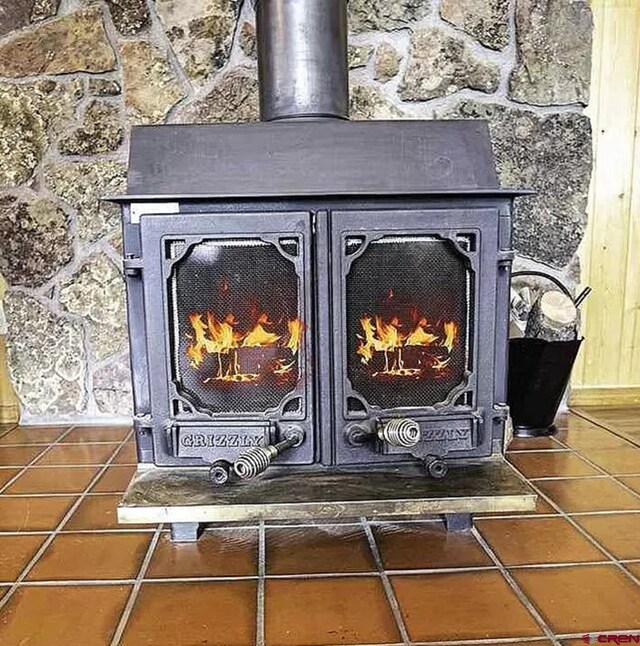 interior details featuring a wood stove