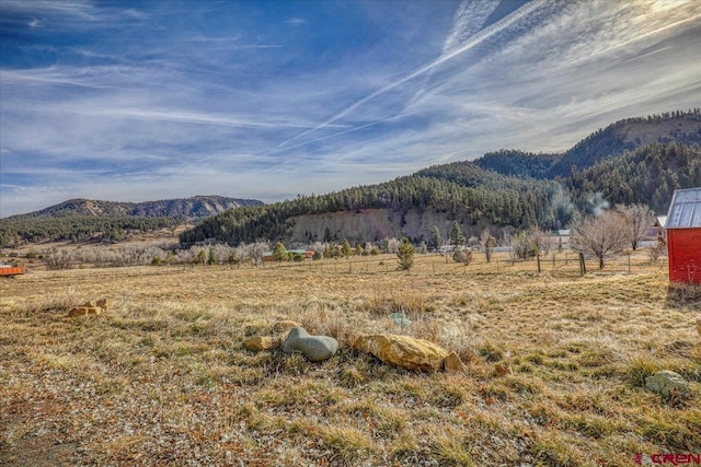 property view of mountains featuring a rural view