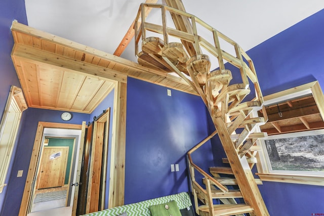 stairway featuring lofted ceiling