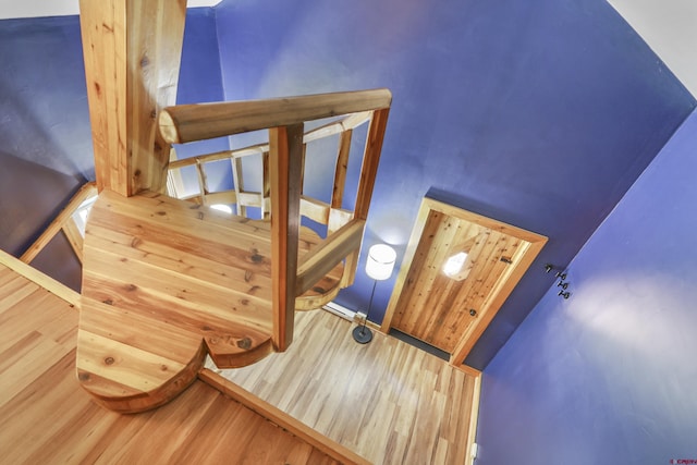 staircase with wood finished floors