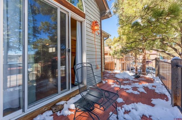 view of snow covered deck