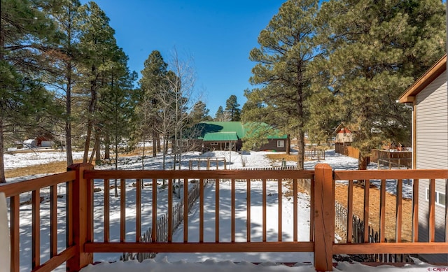 view of snow covered deck