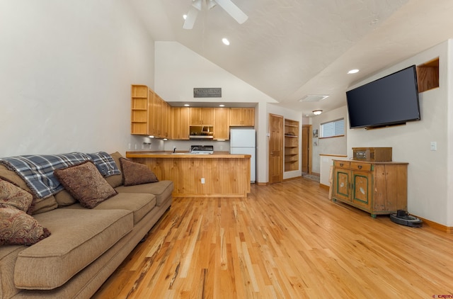 living area with light wood-type flooring, high vaulted ceiling, recessed lighting, baseboards, and ceiling fan