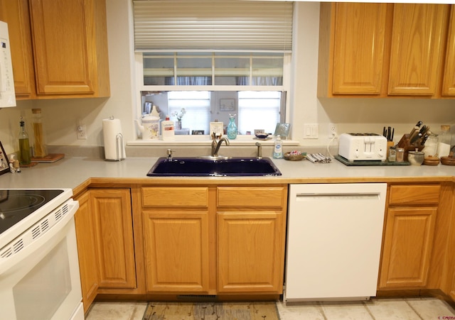 780 Cypresswood Ln, Delta, CO 81416 - kitchen with white appliances, a sink, and light countertops