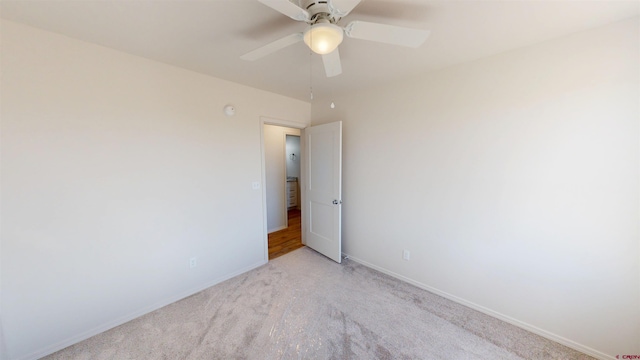 3601 Tinker Dr, Aztec, NM 87410 - spare room featuring a ceiling fan, light colored carpet, and baseboards