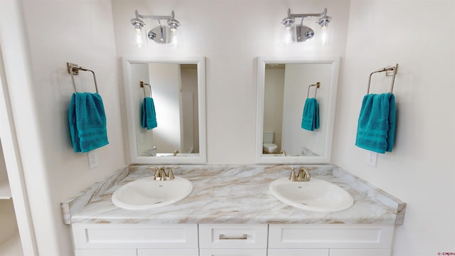 3601 Tinker Dr, Aztec, NM 87410 - bathroom with double vanity, toilet, and a sink