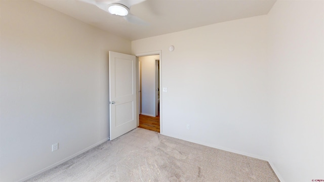 3601 Tinker Dr, Aztec, NM 87410 - empty room with light colored carpet, baseboards, and ceiling fan