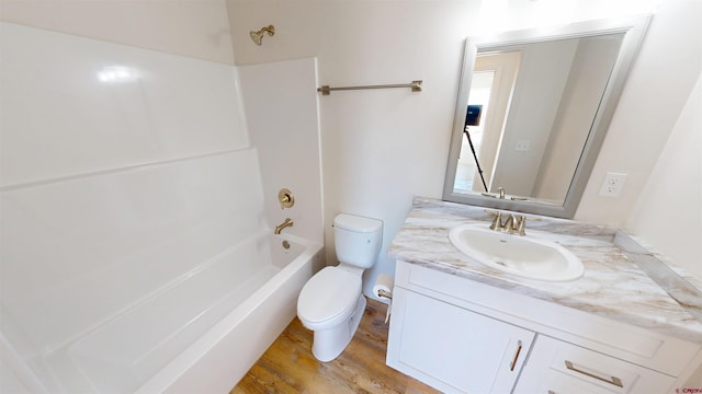 3601 Tinker Dr, Aztec, NM 87410 - full bath with wood finished floors, toilet, shower / washtub combination, and vanity