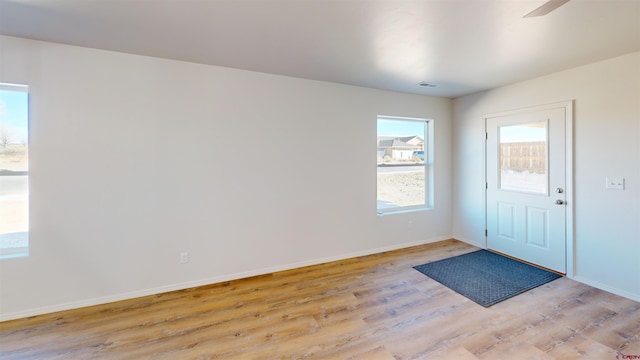 3601 Tinker Dr, Aztec, NM 87410 - entrance foyer featuring visible vents, light wood-type flooring, and baseboards