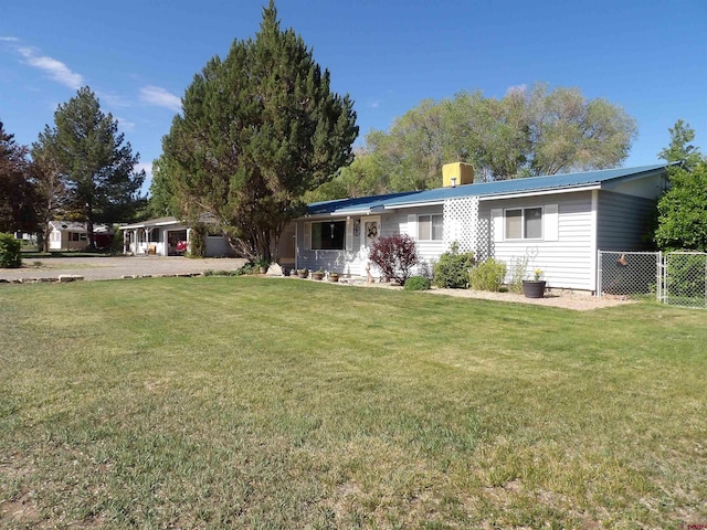 745 Hartig St, Delta, CO 81416 - view of front of house featuring a chimney and metal roof