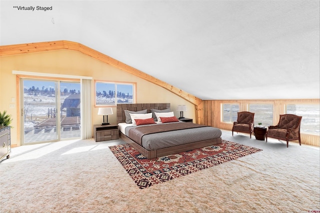 carpeted bedroom with vaulted ceiling