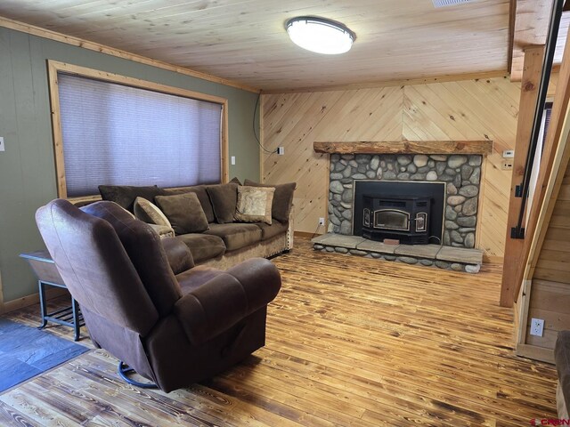 living area featuring wooden walls, wooden ceiling, and hardwood / wood-style floors