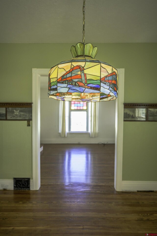 1003 San Juan St, Trinidad, CO 81082 - hall featuring dark wood-type flooring and baseboards