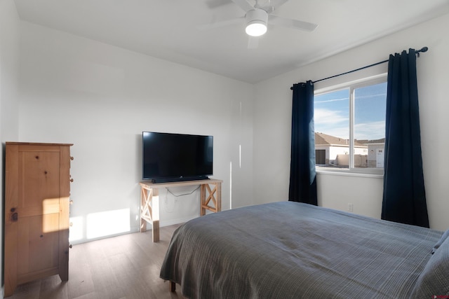 2305 Mountain Pines Dr, Montrose, CO 81401 - bedroom with wood finished floors and a ceiling fan
