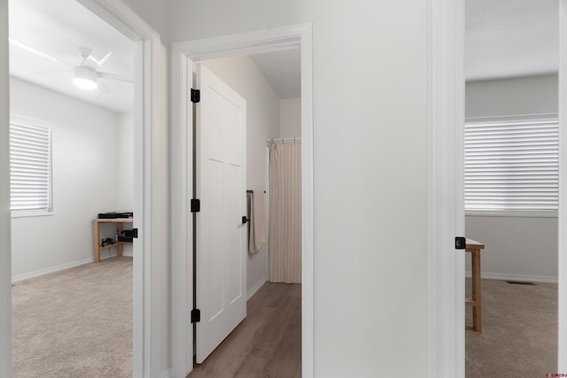2305 Mountain Pines Dr, Montrose, CO 81401 - hall with baseboards, visible vents, and carpet