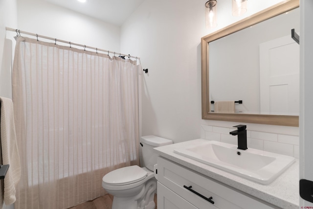 2305 Mountain Pines Dr, Montrose, CO 81401 - full bath with decorative backsplash, toilet, and vanity