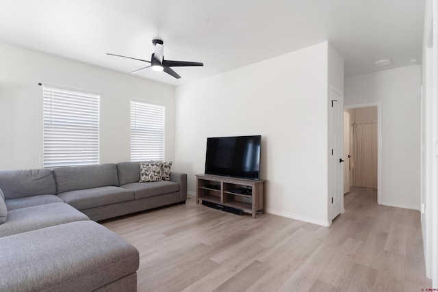 2305 Mountain Pines Dr, Montrose, CO 81401 - living area featuring baseboards, ceiling fan, and light wood-style floors