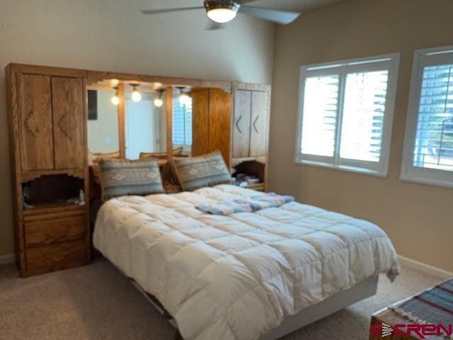 440 Old Goat Trl, Cedaredge, CO 81413 - bedroom with light colored carpet, ceiling fan, and baseboards