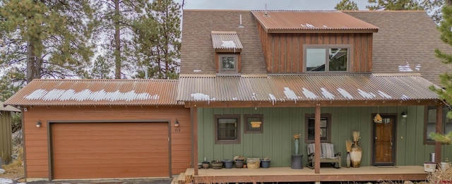 view of front facade with an attached garage and covered porch