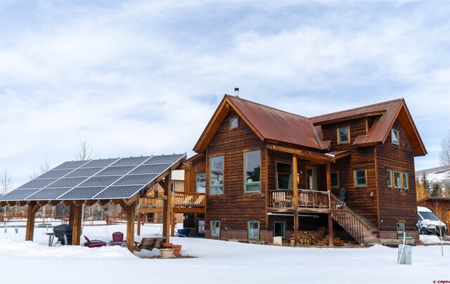 407 Cascadilla St, Crested Butte, CO 81224 - snow covered house with ground mounted solar panels