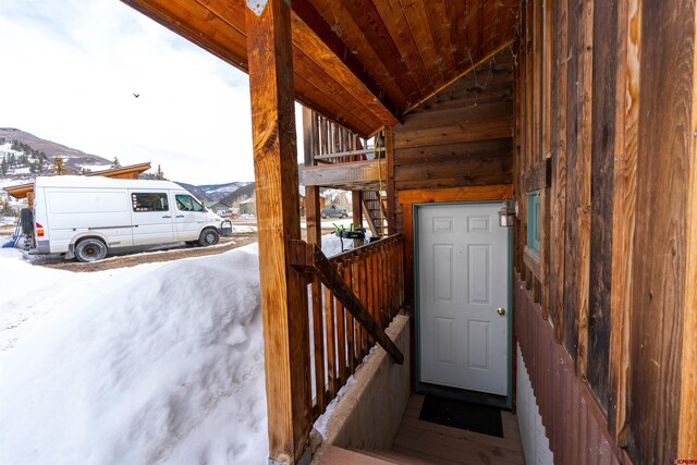 407 Cascadilla St, Crested Butte, CO 81224 - snow covered property entrance featuring a mountain view