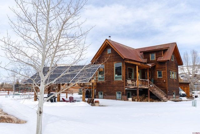 407 Cascadilla St, Crested Butte, CO 81224 - snow covered house featuring ground mounted solar panels