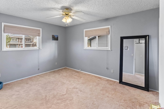 801 S Nevada Ave, Montrose, CO 81401 - carpeted spare room with a textured ceiling, baseboards, and a ceiling fan