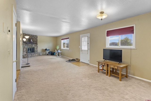 801 S Nevada Ave, Montrose, CO 81401 - interior space featuring baseboards, a fireplace, and carpet flooring