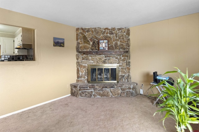 801 S Nevada Ave, Montrose, CO 81401 - living area featuring baseboards, carpet flooring, and a stone fireplace
