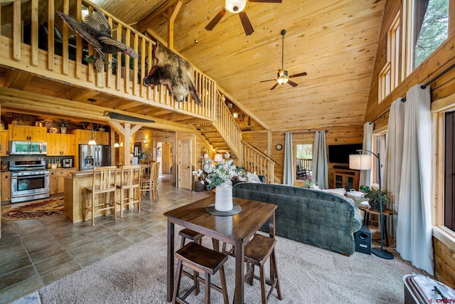 1838 Beaver Creek Dr, Bayfield, CO 81122 - living area with stairway, wooden ceiling, high vaulted ceiling, wooden walls, and ceiling fan