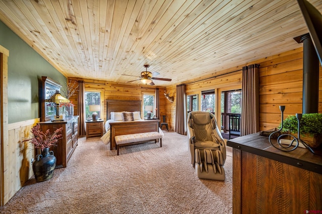 1838 Beaver Creek Dr, Bayfield, CO 81122 - carpeted bedroom featuring access to exterior, wooden walls, multiple windows, and wood ceiling