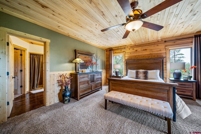 1838 Beaver Creek Dr, Bayfield, CO 81122 - bedroom featuring a wainscoted wall, wood ceiling, carpet floors, and multiple windows