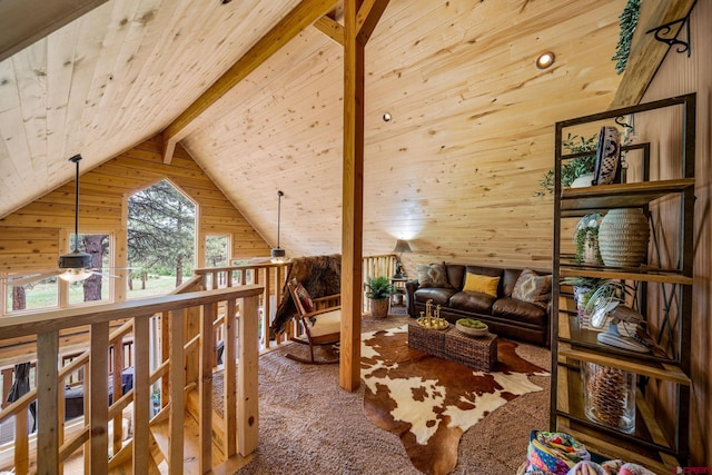 1838 Beaver Creek Dr, Bayfield, CO 81122 - sitting room featuring lofted ceiling with beams, wood walls, carpet, a ceiling fan, and wood ceiling
