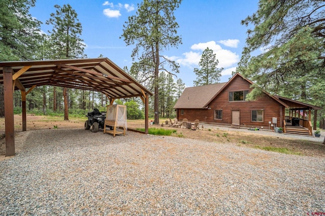 1838 Beaver Creek Dr, Bayfield, CO 81122 - view of yard with gravel driveway and a carport