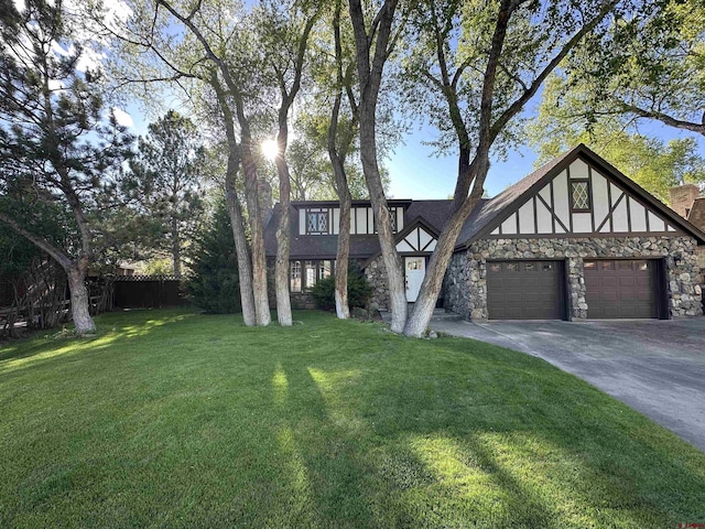 6 Mountain View Pl, Alamosa, CO 81101 - view of front of property with stone siding, a garage, and driveway