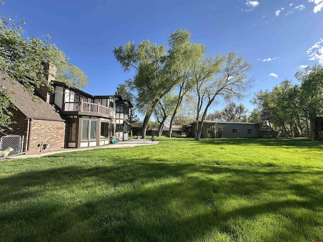 6 Mountain View Pl, Alamosa, CO 81101 - view of grassy yard with a patio