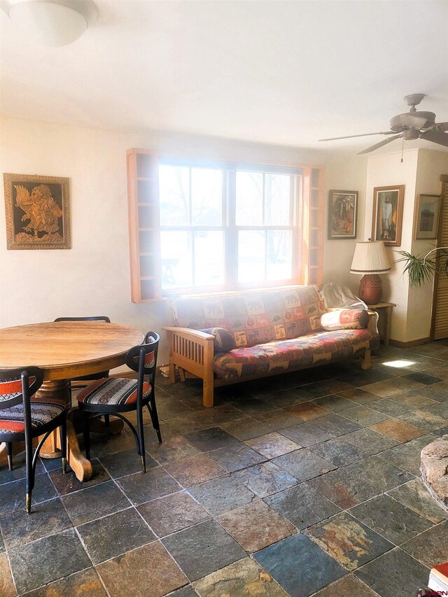 1435 Pine St, Norwood, CO 81423 - living room featuring stone tile floors and ceiling fan