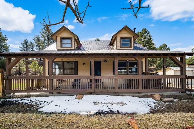 view of front of house with a porch and metal roof