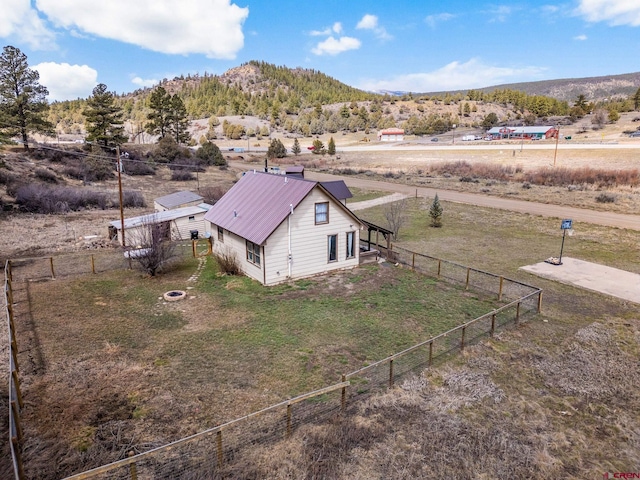 birds eye view of property featuring a rural view and a mountain view