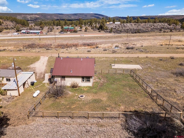 birds eye view of property with a mountain view and a rural view